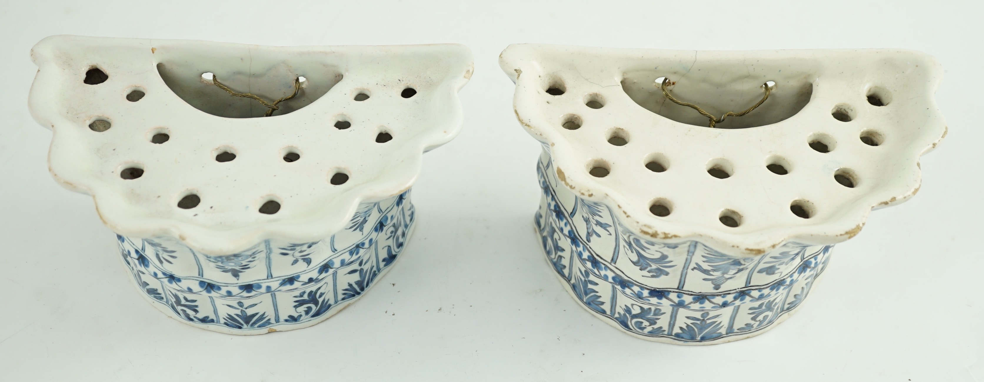 Two similar 18th century Delft blue and white hanging bough pots, 18.3cm wide
